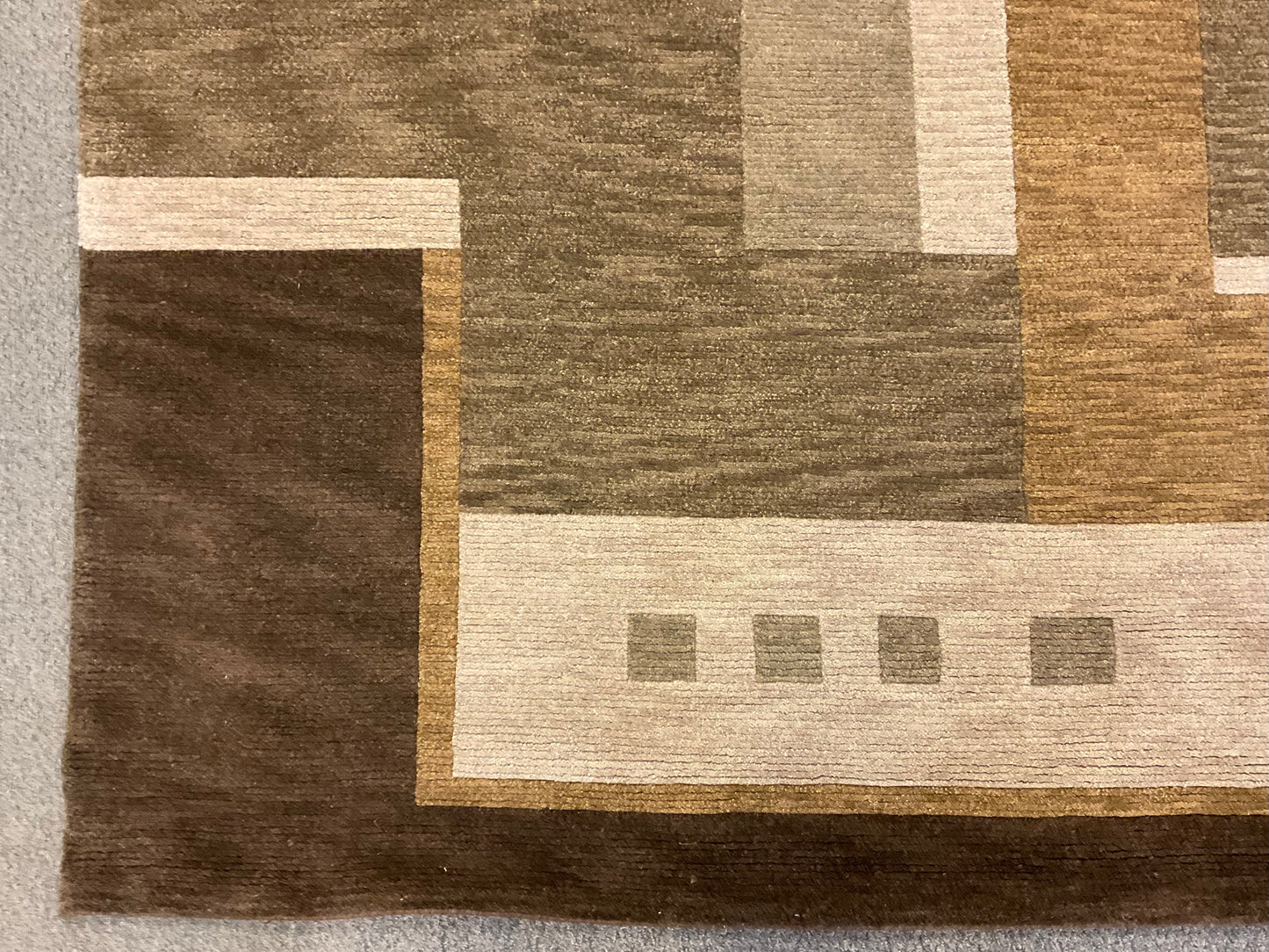 This contemporary geometric rug features a warm, earthy palette |1138