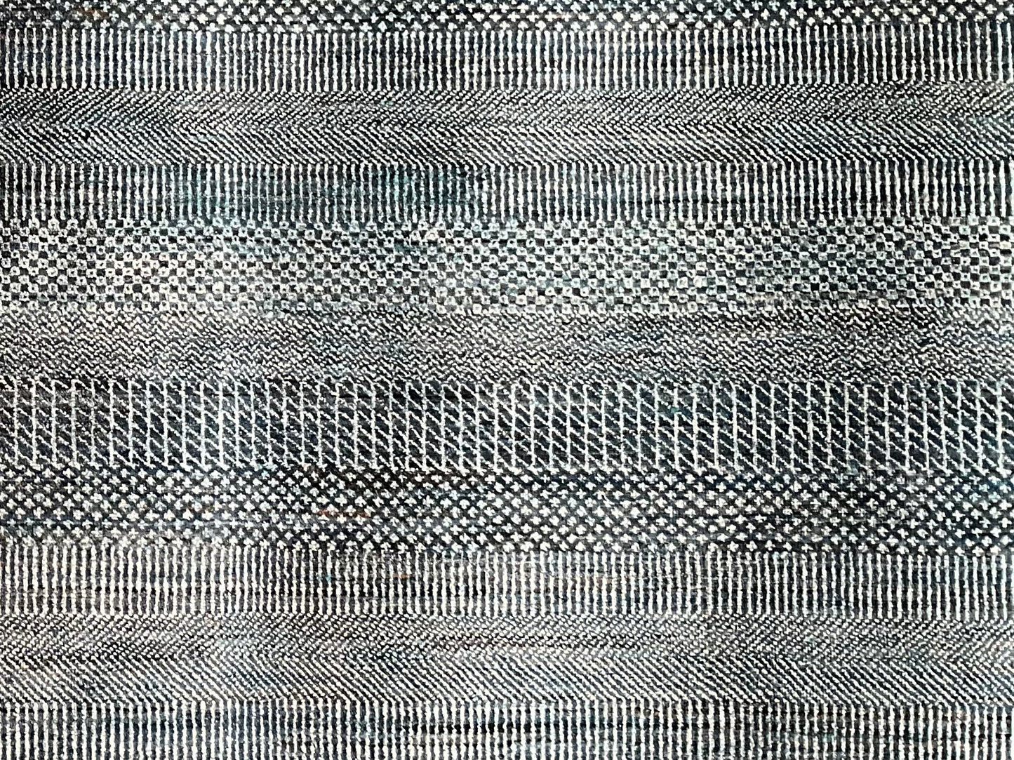 A modern wool and silk rug brings together soft tones of blue, grey | NU-4617