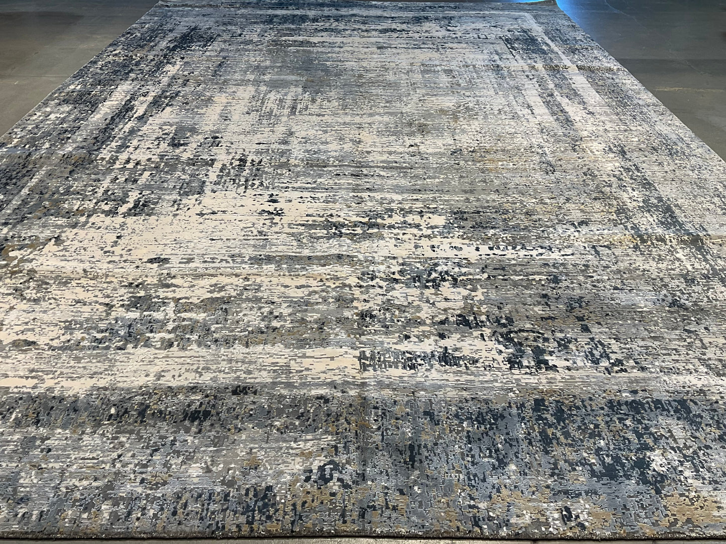 Rug with white, charcoal, soft grey, and layered blues | NU-7460