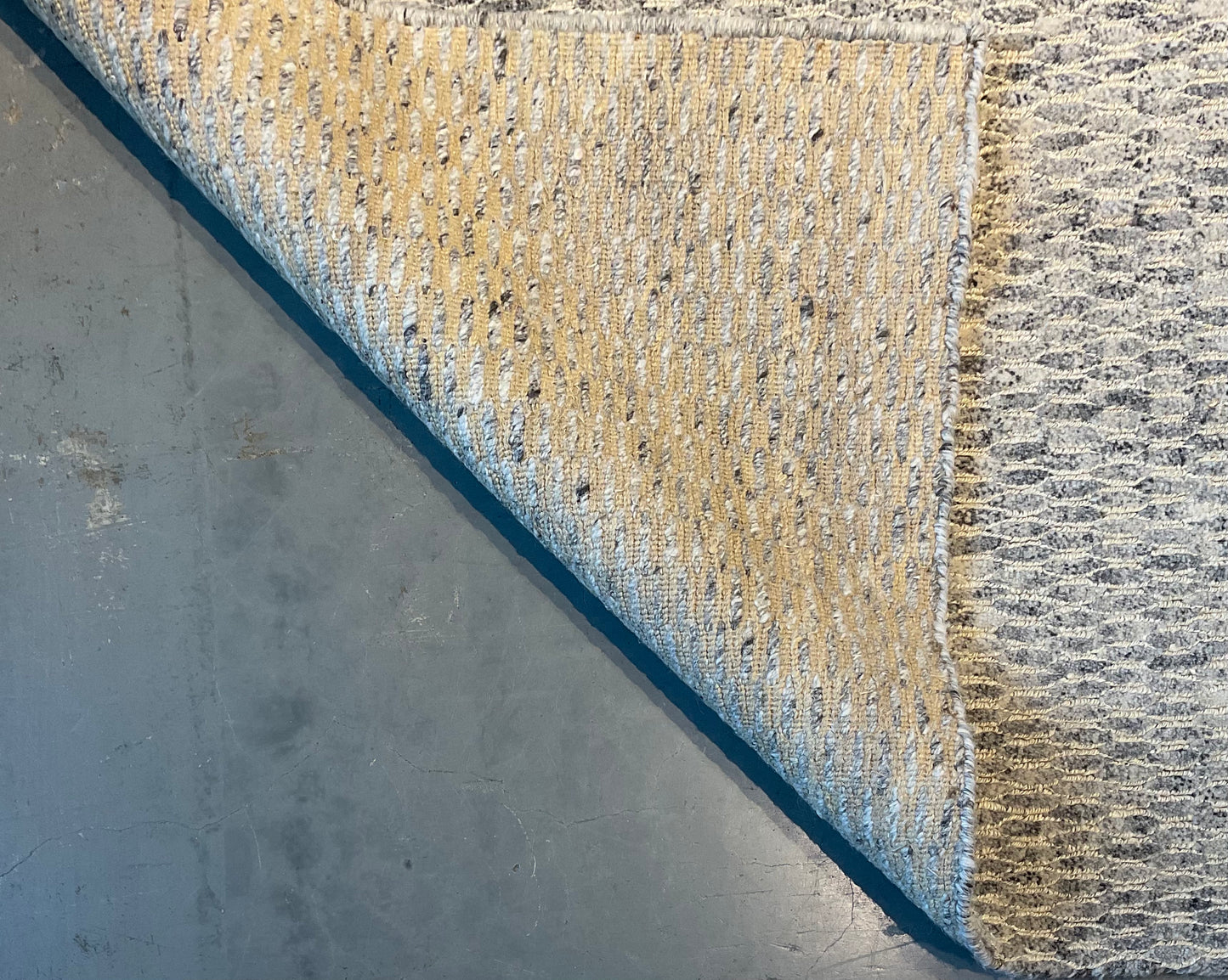 Textured rug features a subtle organic pattern, undyed wool | NU-4618