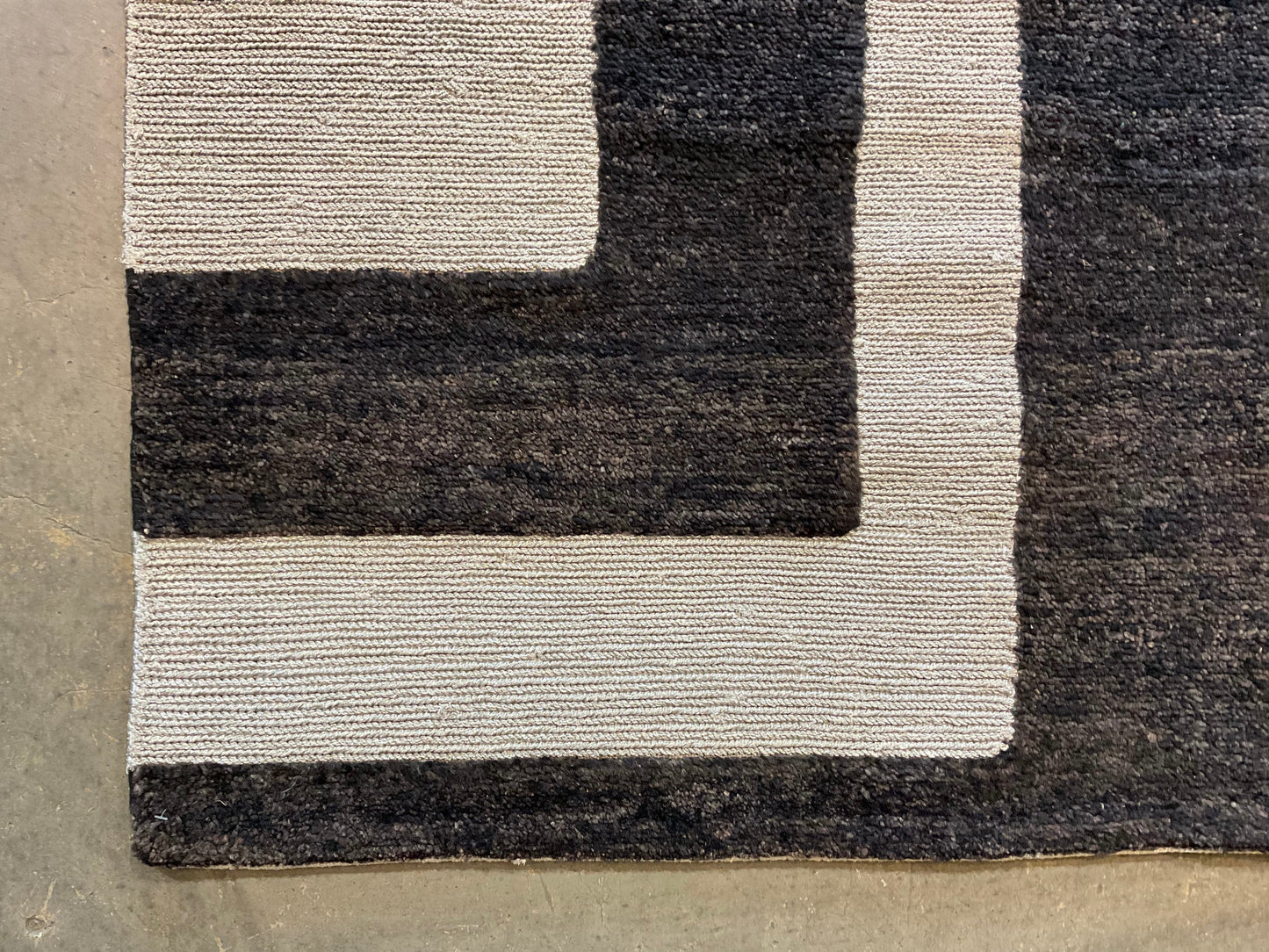 Ultra-modern rug features a deep black and charcoal | NU-2585