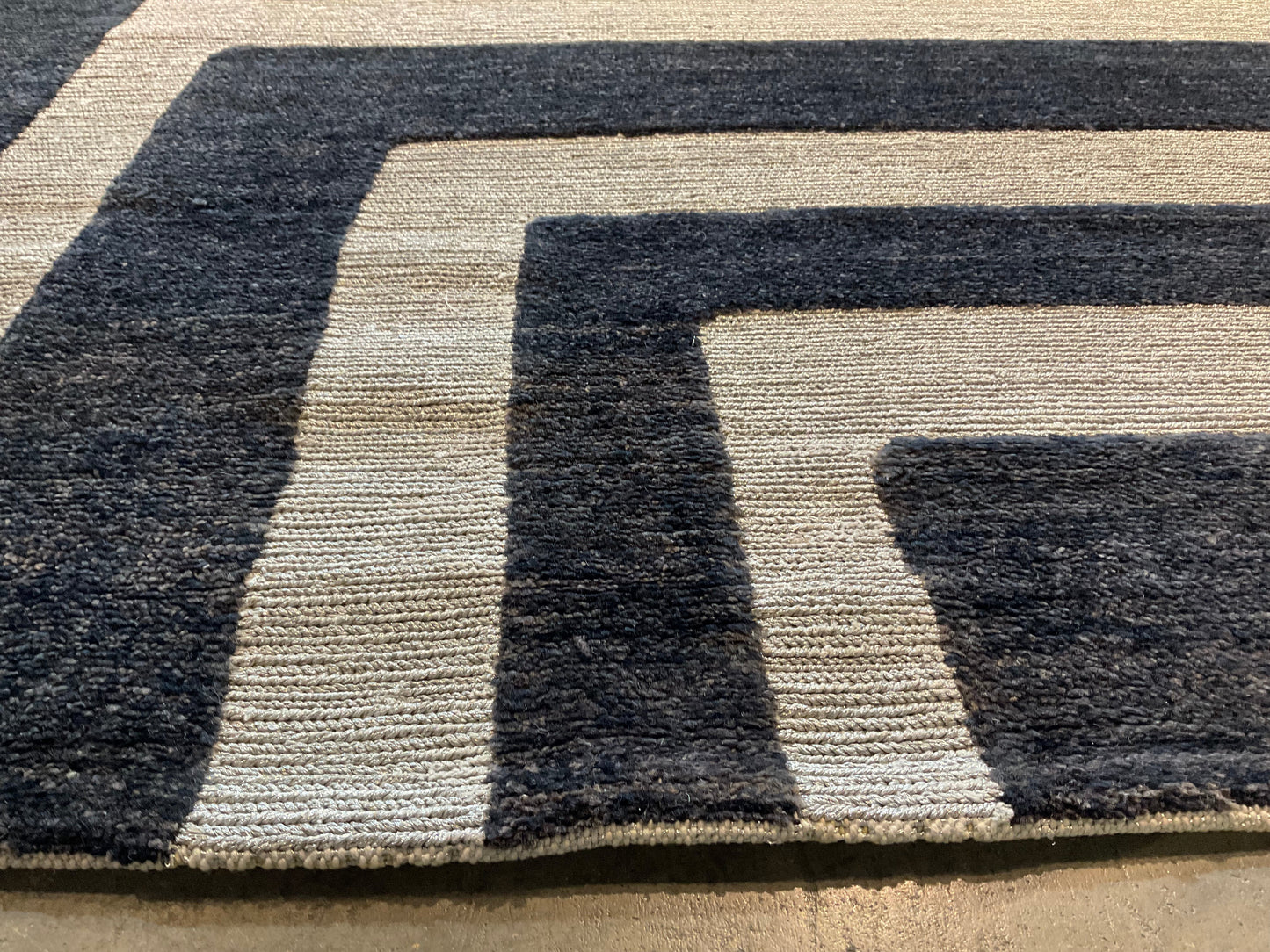 Ultra-modern rug features a deep black and charcoal | NU-2585
