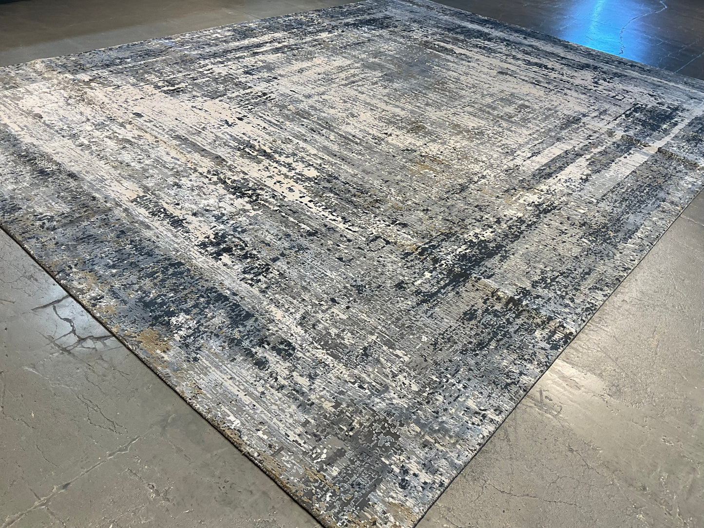 Rug with white, charcoal, soft grey, and layered blues | NU-7460