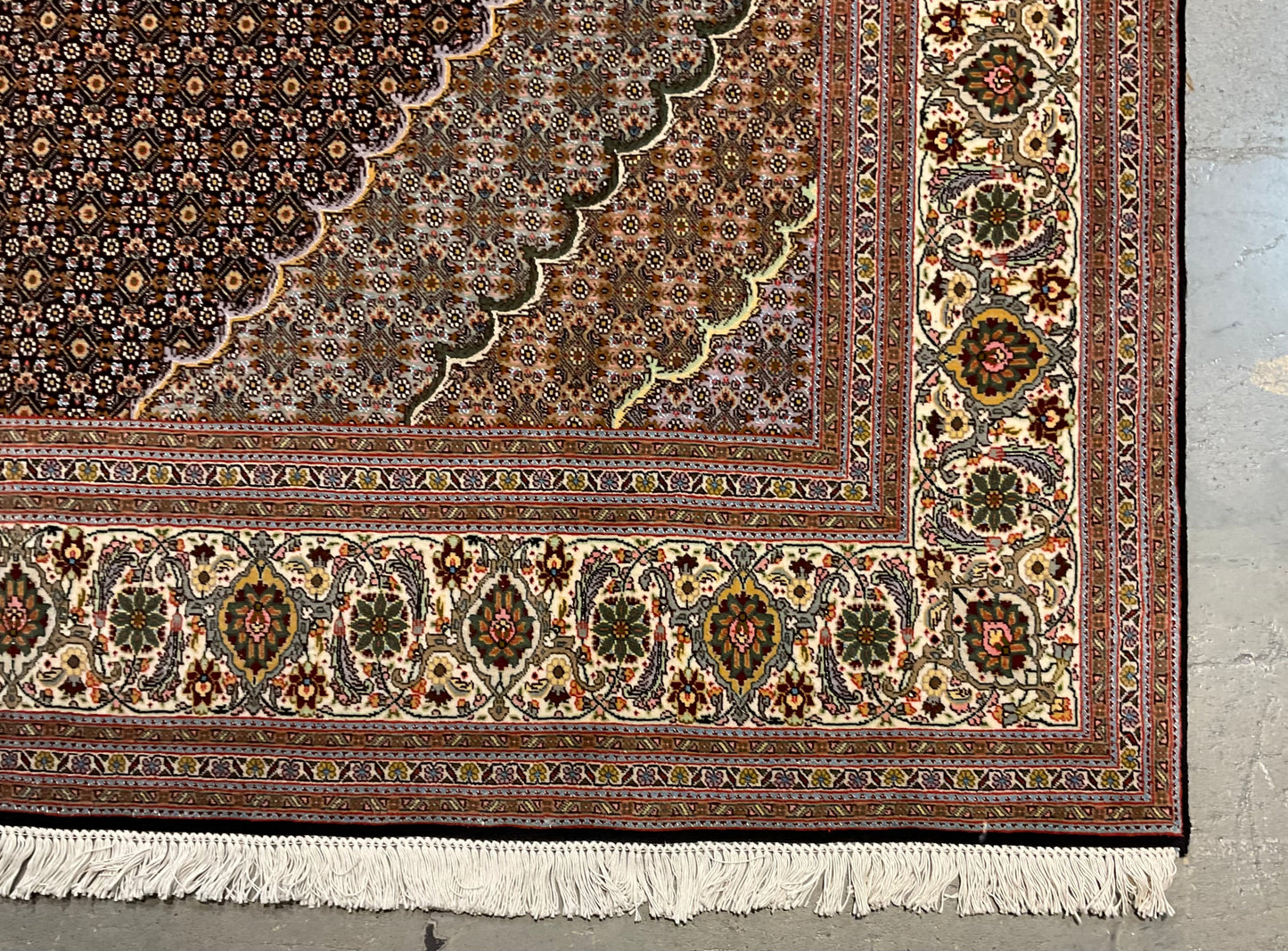 Mahi Tabriz rug features a deep black-brown field | NU-4780