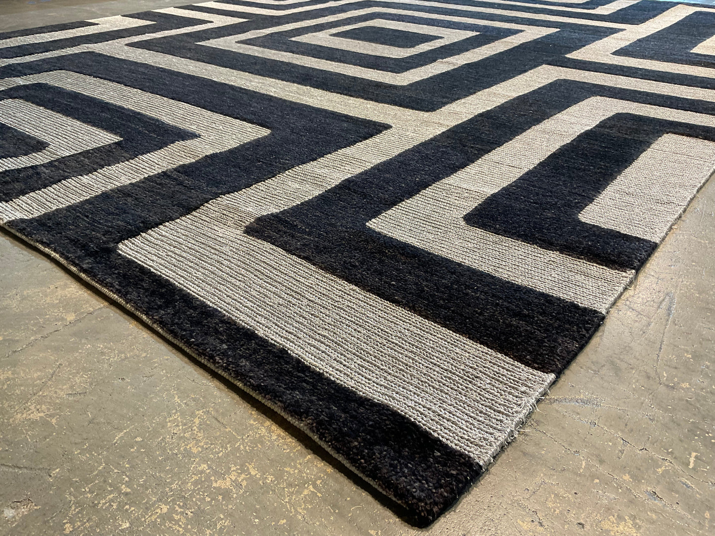 Ultra-modern rug features a deep black and charcoal | NU-2585