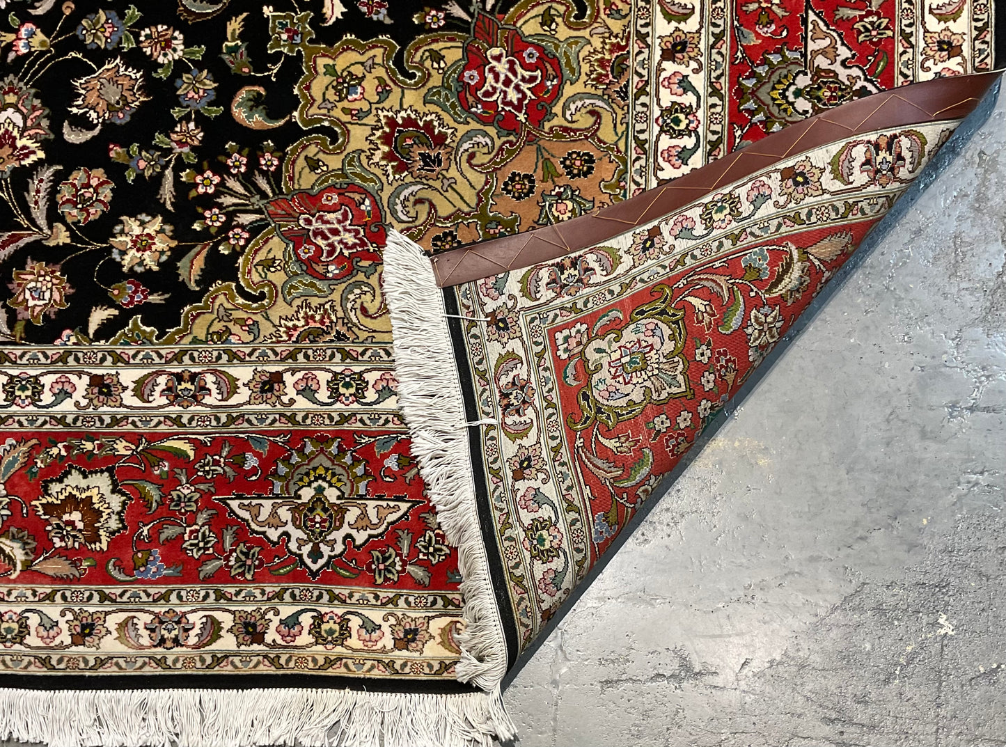 Floral Tabriz rug features a deep black background | NU-2387