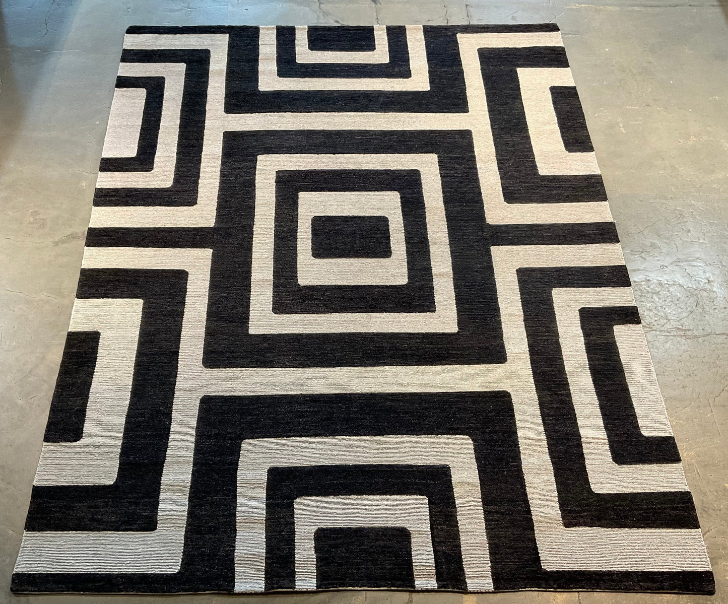 Ultra-modern rug features a deep black and charcoal | NU-2585