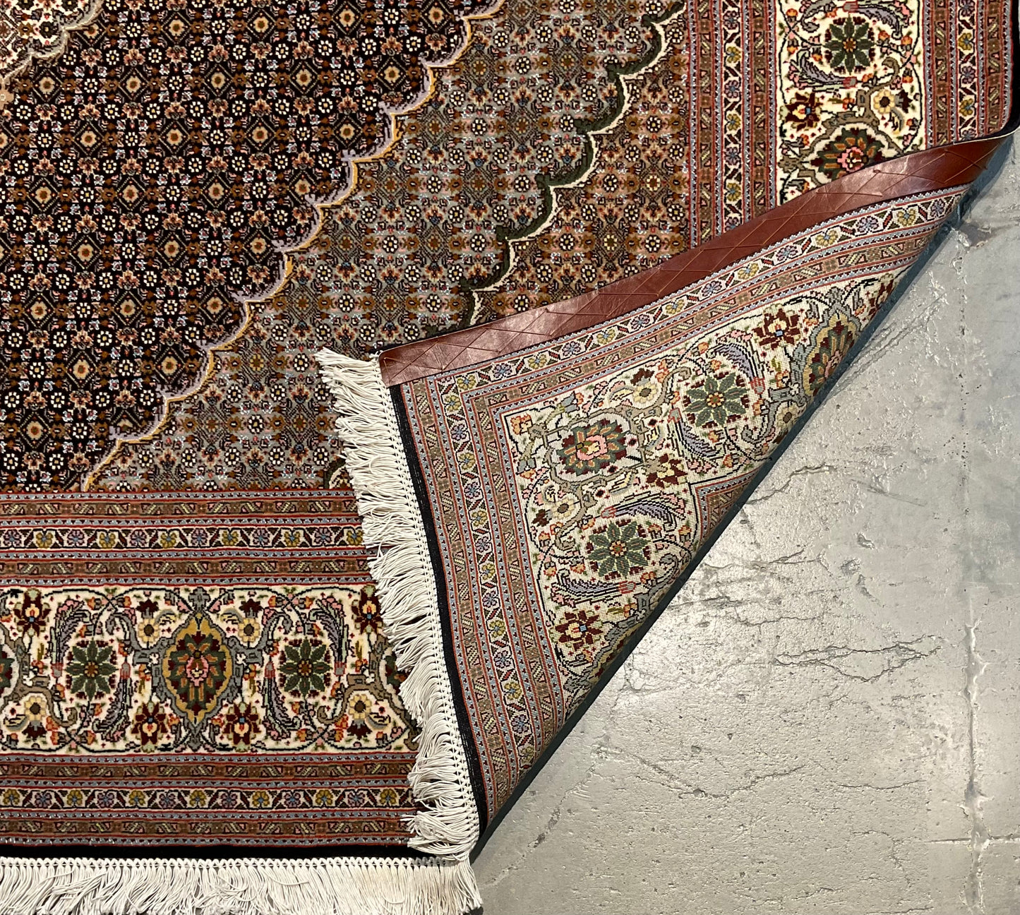 Mahi Tabriz rug features a deep black-brown field | NU-4780
