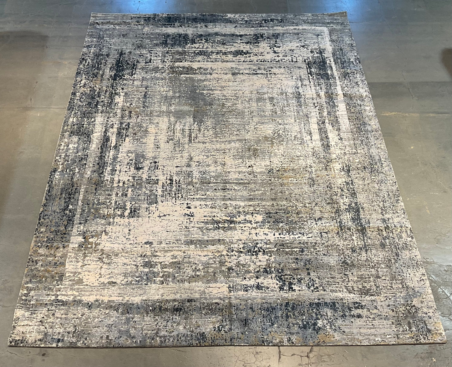 Rug with white, charcoal, soft grey, and layered blues | NU-7460