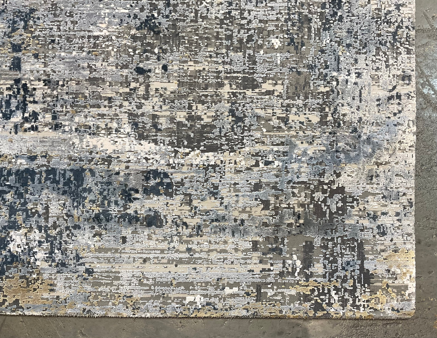 Rug with white, charcoal, soft grey, and layered blues | NU-7460