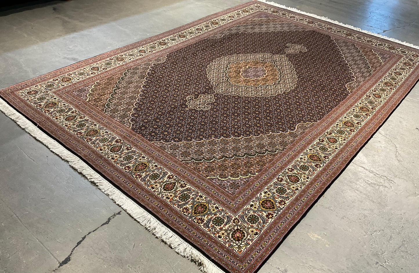 Mahi Tabriz rug features a deep black-brown field | NU-4780