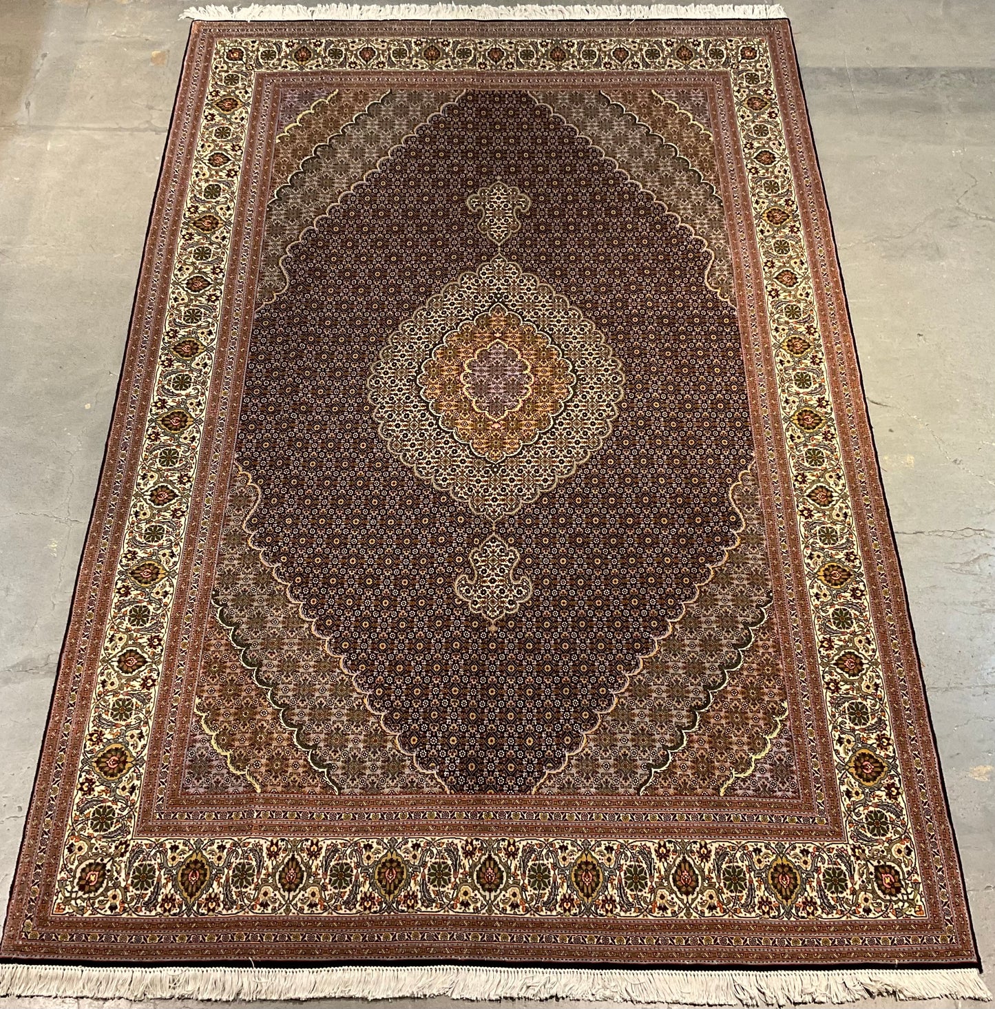 Mahi Tabriz rug features a deep black-brown field | NU-4780