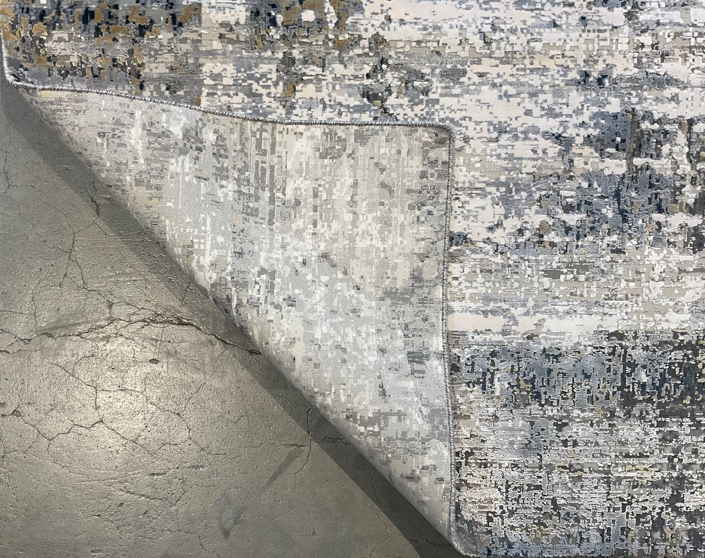 Rug with white, charcoal, soft grey, and layered blues | NU-7460