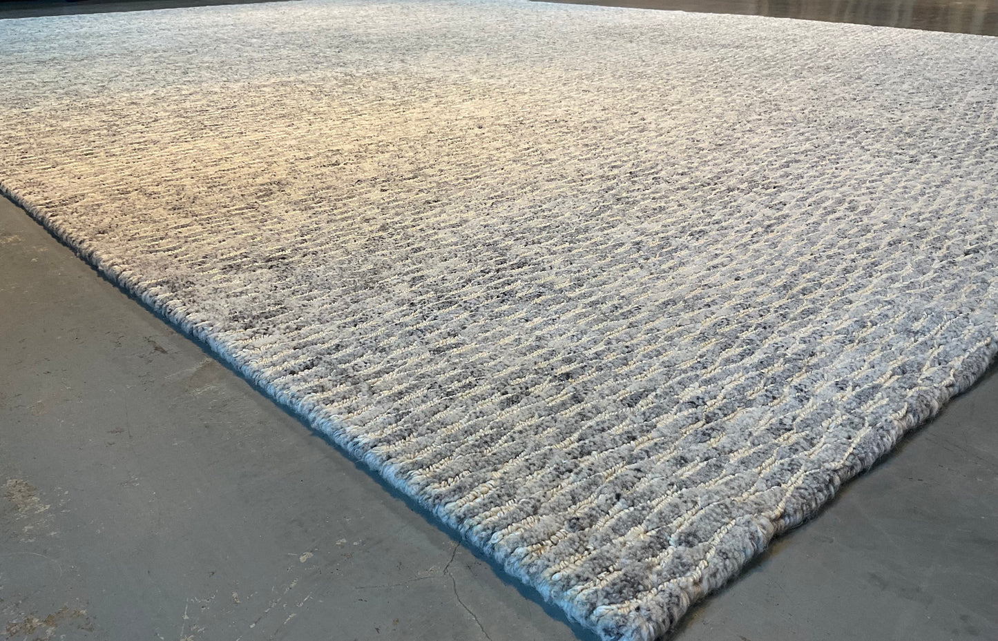 Textured rug features a subtle organic pattern, undyed wool | NU-4618