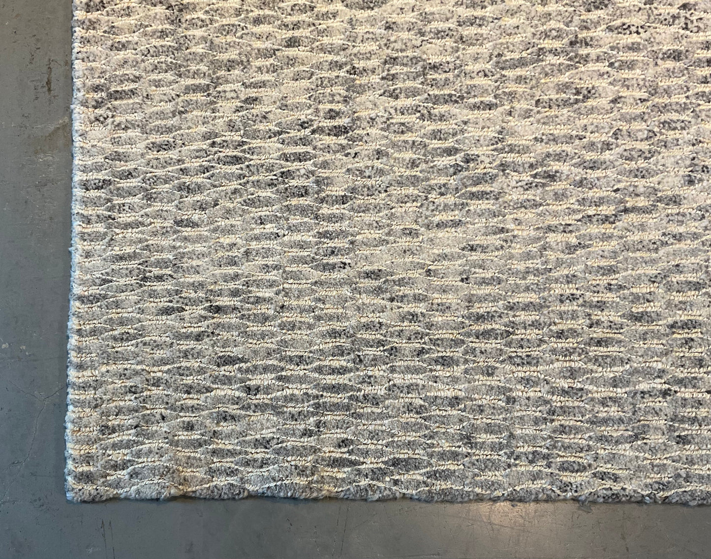 Textured rug features a subtle organic pattern, undyed wool | NU-4618